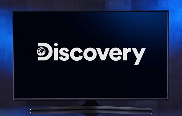 Flat-screen TV set displaying logo of Discovery Channel — Stock Photo, Image