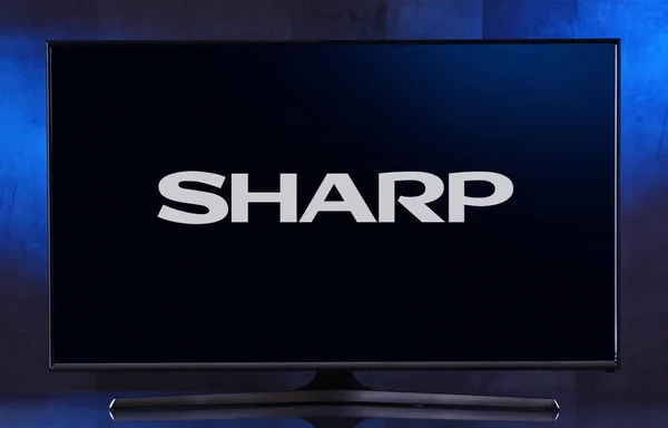 TV s plochou obrazovkou zobrazující logo Sharp — Stock fotografie
