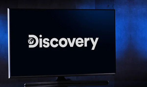 Flat-screen TV set displaying logo of Discovery Channel — Stock Photo, Image