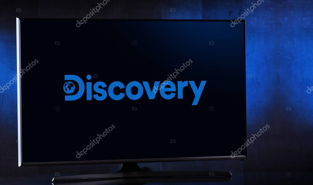 POZNAN, POL - FEB 04, 2020: Flat-screen TV set displaying logo of Discovery Channel, an American pay television network and flagship channel owned by Discovery, Inc.