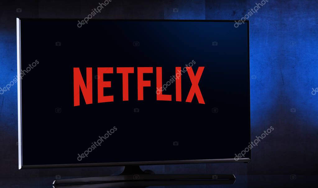 POZNAN, POL - FEB 04, 2020: Flat-screen TV set displaying logo of Netflix, an American media-services provider headquartered in Los Gatos, California, USA