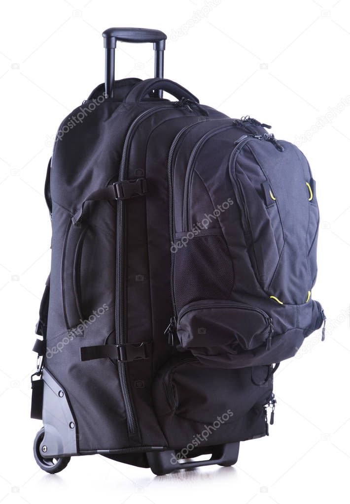 Large black tourist backpack with wheels isolated on white background