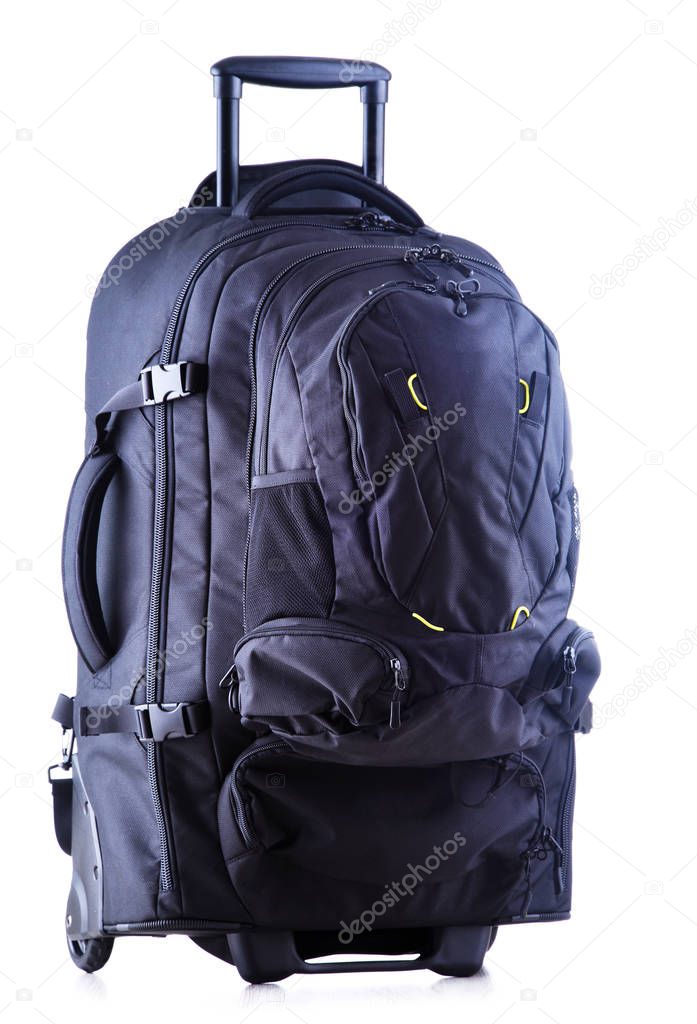Large black tourist backpack with wheels isolated on white background