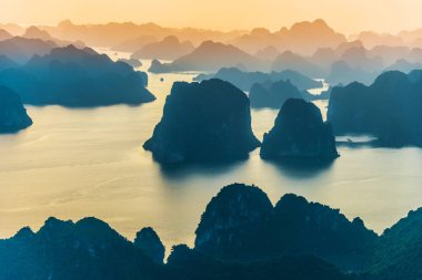 Aerial view of Ha Long Bay, Vietnam during sunset clipart