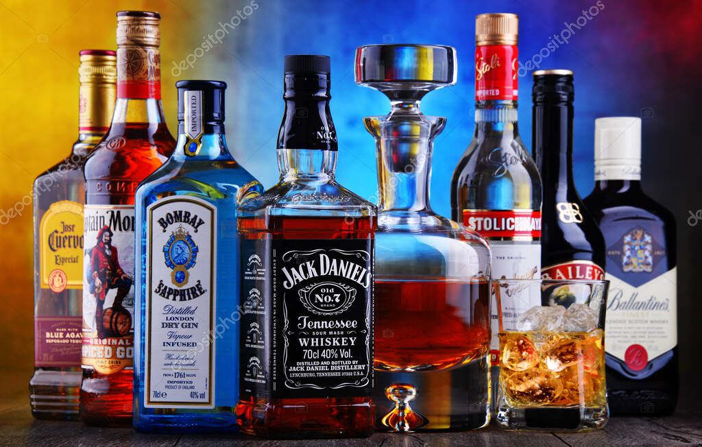 POZNAN, POL - APR 16, 2020: Bottles of assorted global hard  liquor brands including whiskey, vodka, tequila and gin