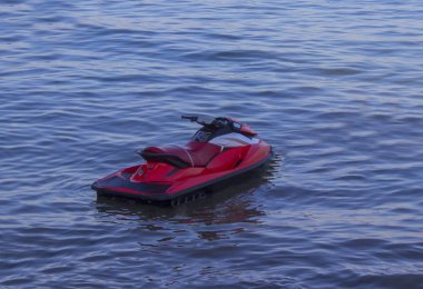 Küçük dalgalar üzerinde bir adam olmadan kırmızı su Jet Ski