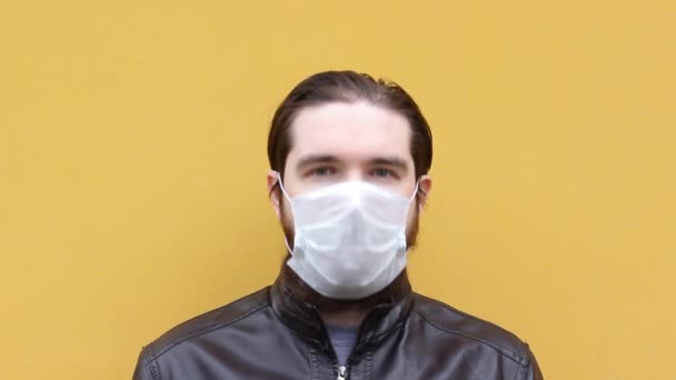 Adult Man Disposable Mask Sneezes Instructions How Wear Respirator Mask — Stock Video