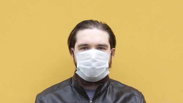 Adult Man Disposable Mask Sneezes Instructions How Wear Respirator Mask — Stock Video