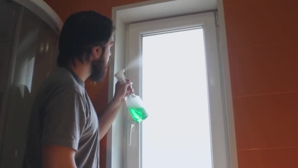 Man Gray Shirt Beard Uses Cleaning Agent Sponge Wash Windows — Stock Video