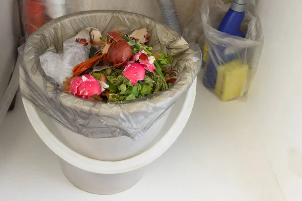 Close-up on kitchen garbage with spoiled eggs from easter 2020 in Trash bin. Separate collection of organic waste as a symbol of ecology. Recycling scraps concept and zero waste lifestyle