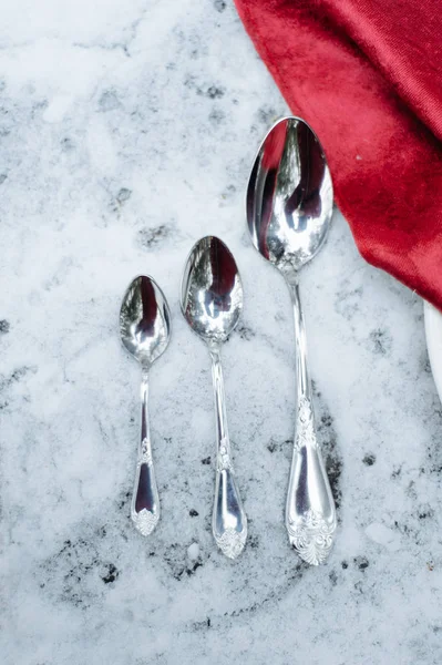 Set on a snowy table spoons — Stock Photo, Image
