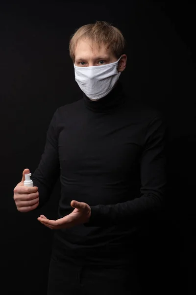 Man Medical Mask Shows How Treat His Hands Antiseptic Coronavirus — Stock Photo, Image