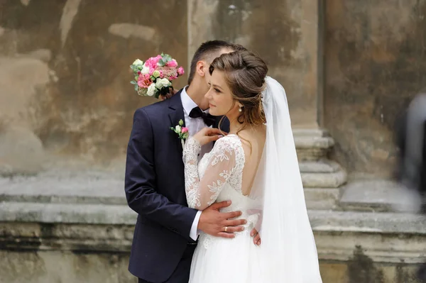 Wedding photo session of a young beautiful couple in the old city.