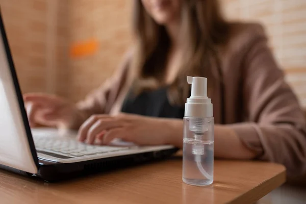 Hand Sanitizers stands near the freelancer workplace.