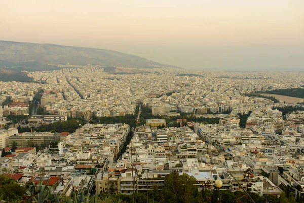 Panorama of the evening city with Lycabettus Hill