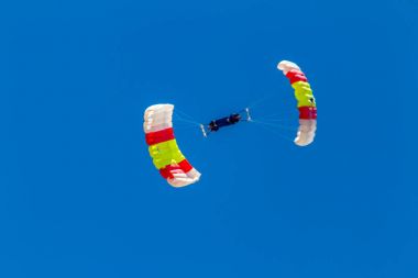 Parachutists of PAPEA on airshow  clipart