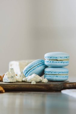Delicious macaron on a wooden board