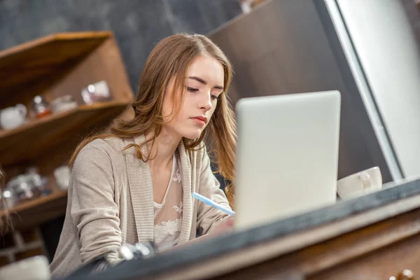 Woman using laptop Stock Image