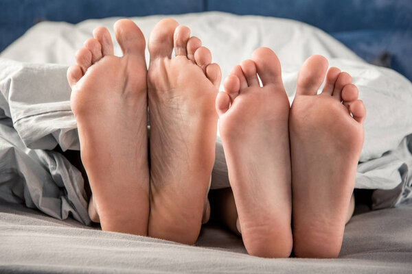 Feet of man and woman
