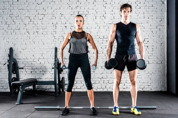 Sportspeople training in gym — Stock Photo, Image
