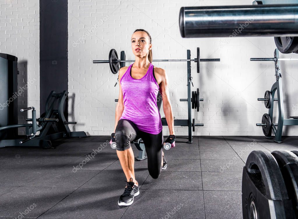Sportswoman exercising in gym