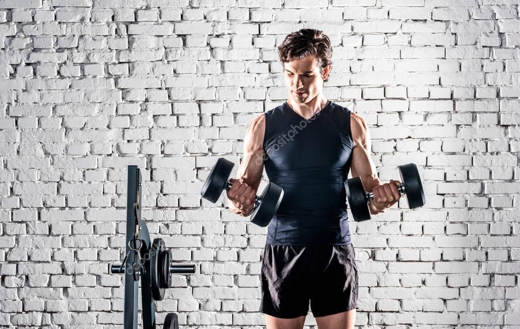 Sportsman exercising in gym