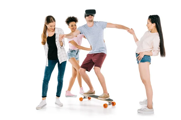 Girls and young man on skateboard — Free Stock Photo
