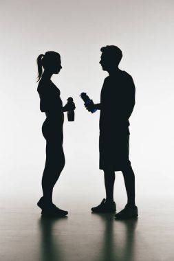 silhouettes of young fit couple clipart