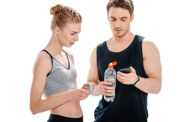 Fit couple looking at smartphone — Stock Photo, Image