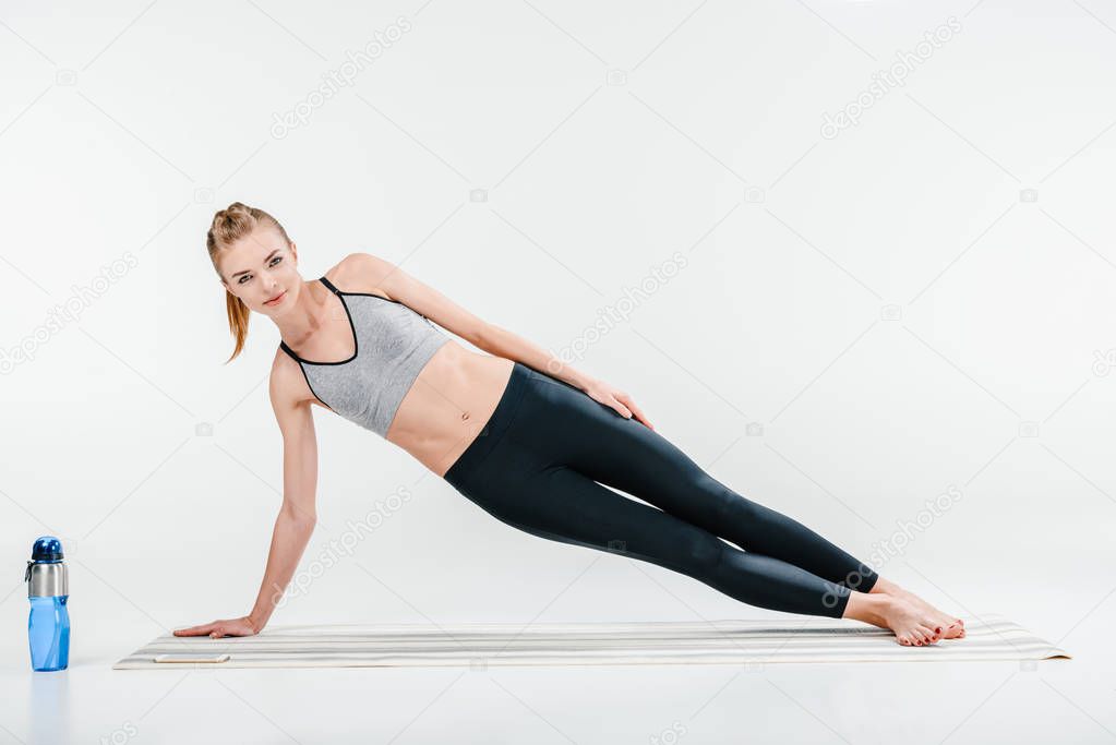 girl doing side plank exercise