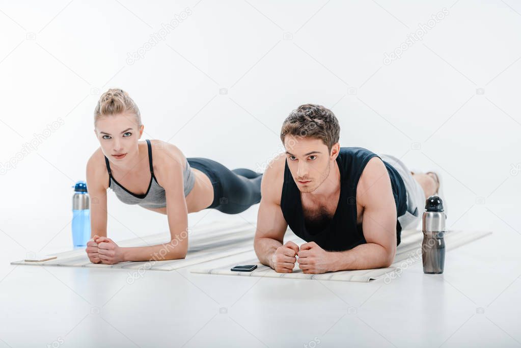 couple doing plank exercise