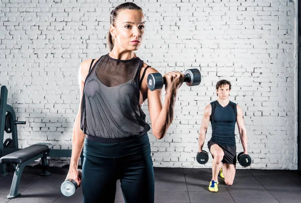 Sportspeople training in gym — Stock Photo