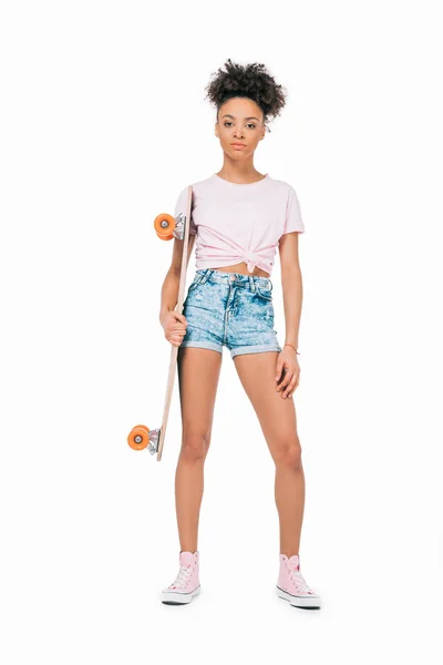 African american girl holding skateboard — Stock Photo