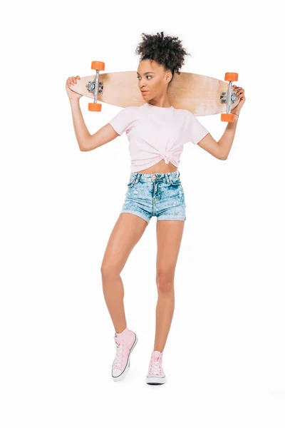 African american girl holding skateboard — Stock Photo