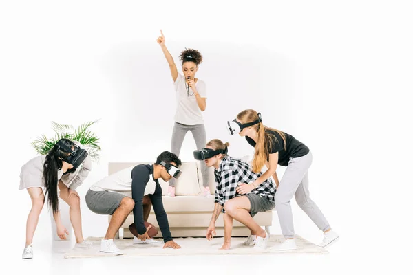 Multiethnic friends in virtual reality headsets — Stock Photo