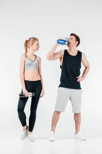 Couple with fitness shakers — Stock Photo