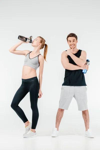Couple with fitness shakers — Stock Photo