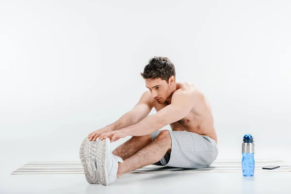 Young man stretching — Stock Photo