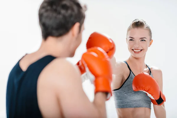 Young girl boxing with trainer — Stock Photo