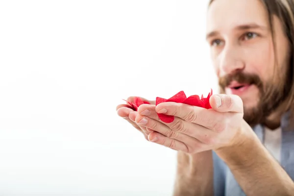 Man blowing paper hearts — Stock Photo, Image