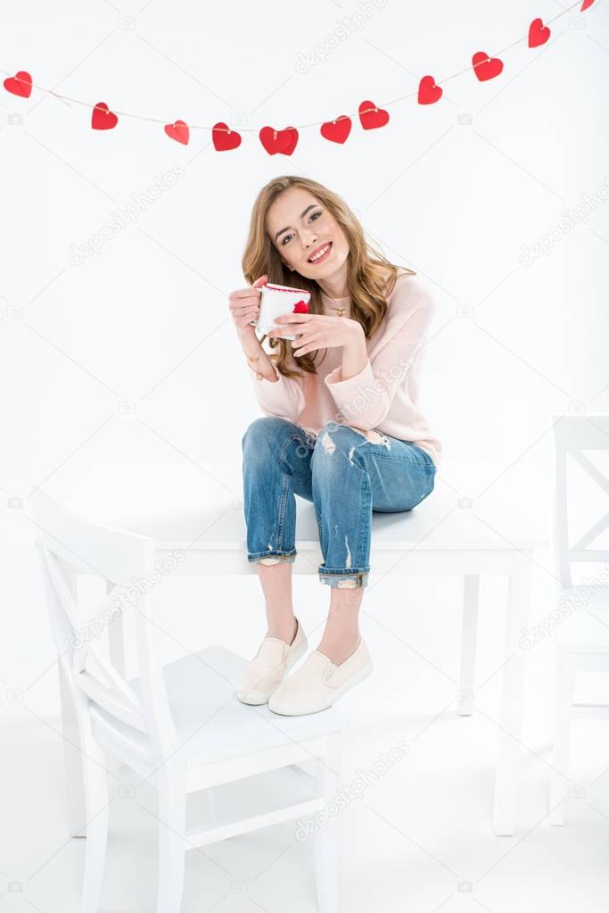 Woman holding cup 