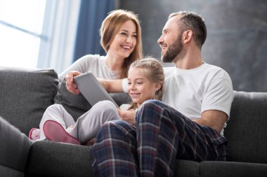 Family using digital tablet clipart
