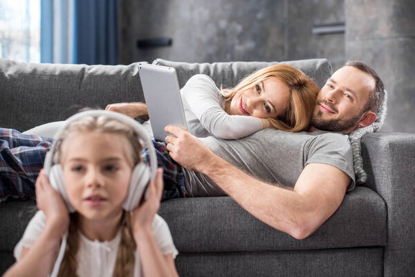 Parents looking at daughter