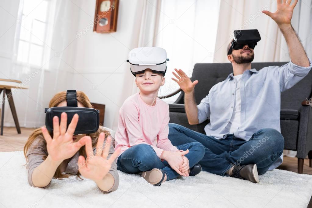 Family in virtual reality headsets