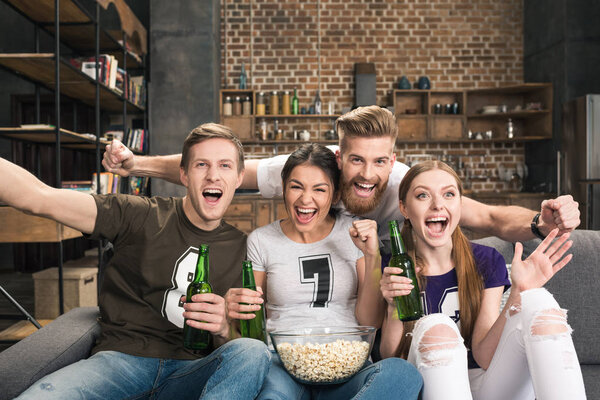 Young friends drinking beer