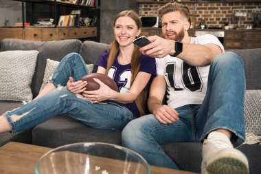 couple watching sports game clipart