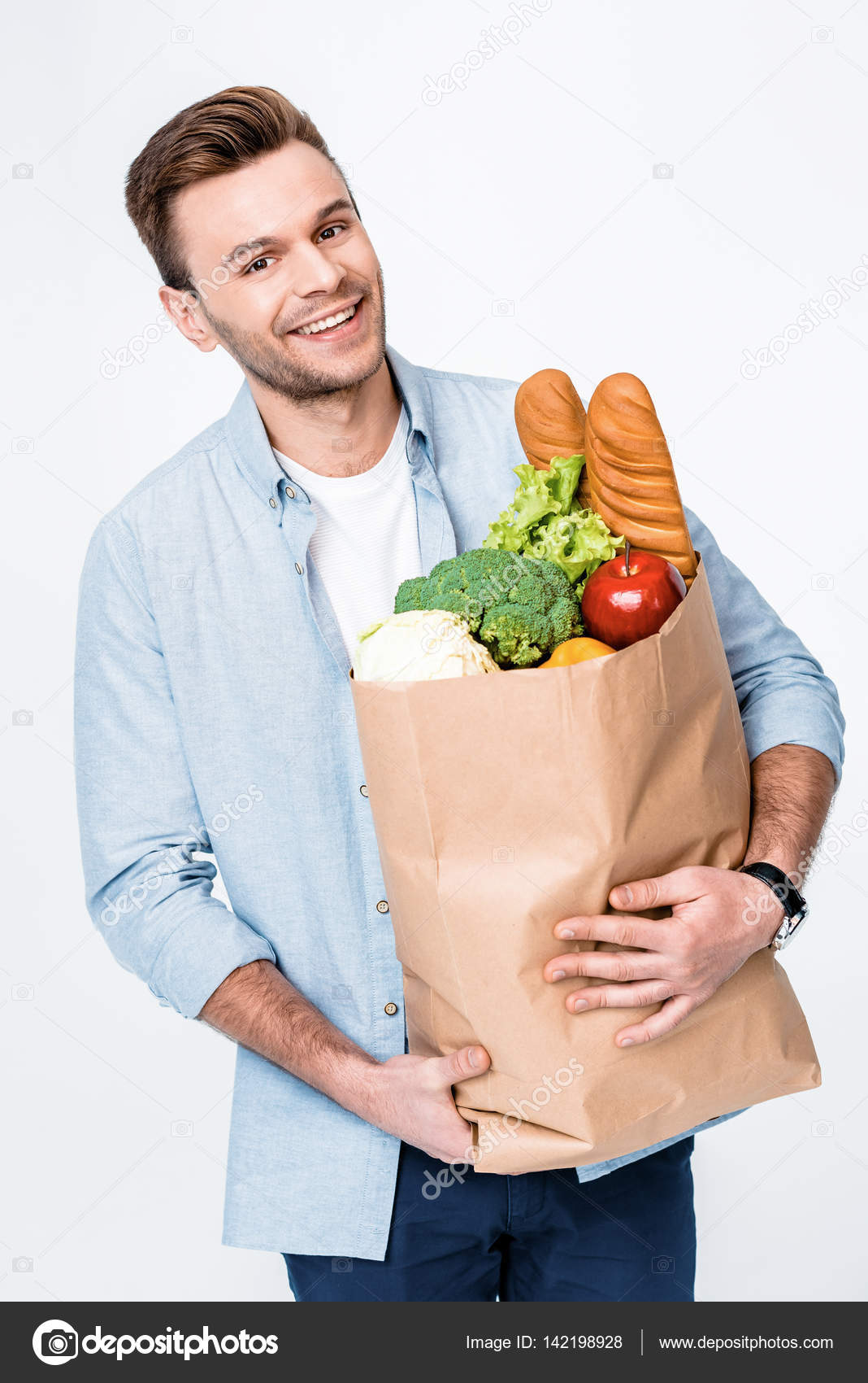 Man holding grocery bag Stock Photo by ©TarasMalyarevich 142198928