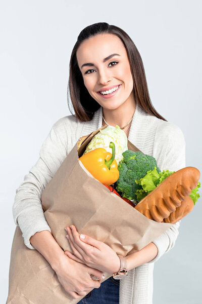 woman holding grocery bag