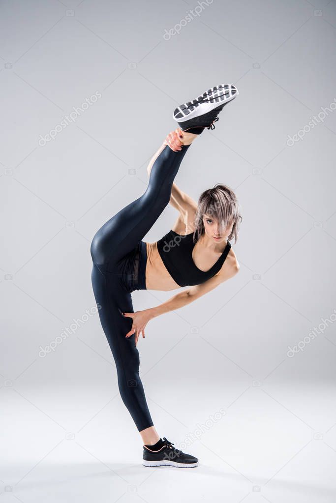 sporty woman stretching