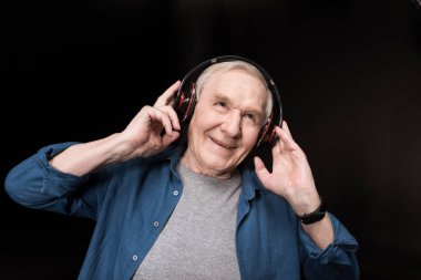 senior man listening music clipart